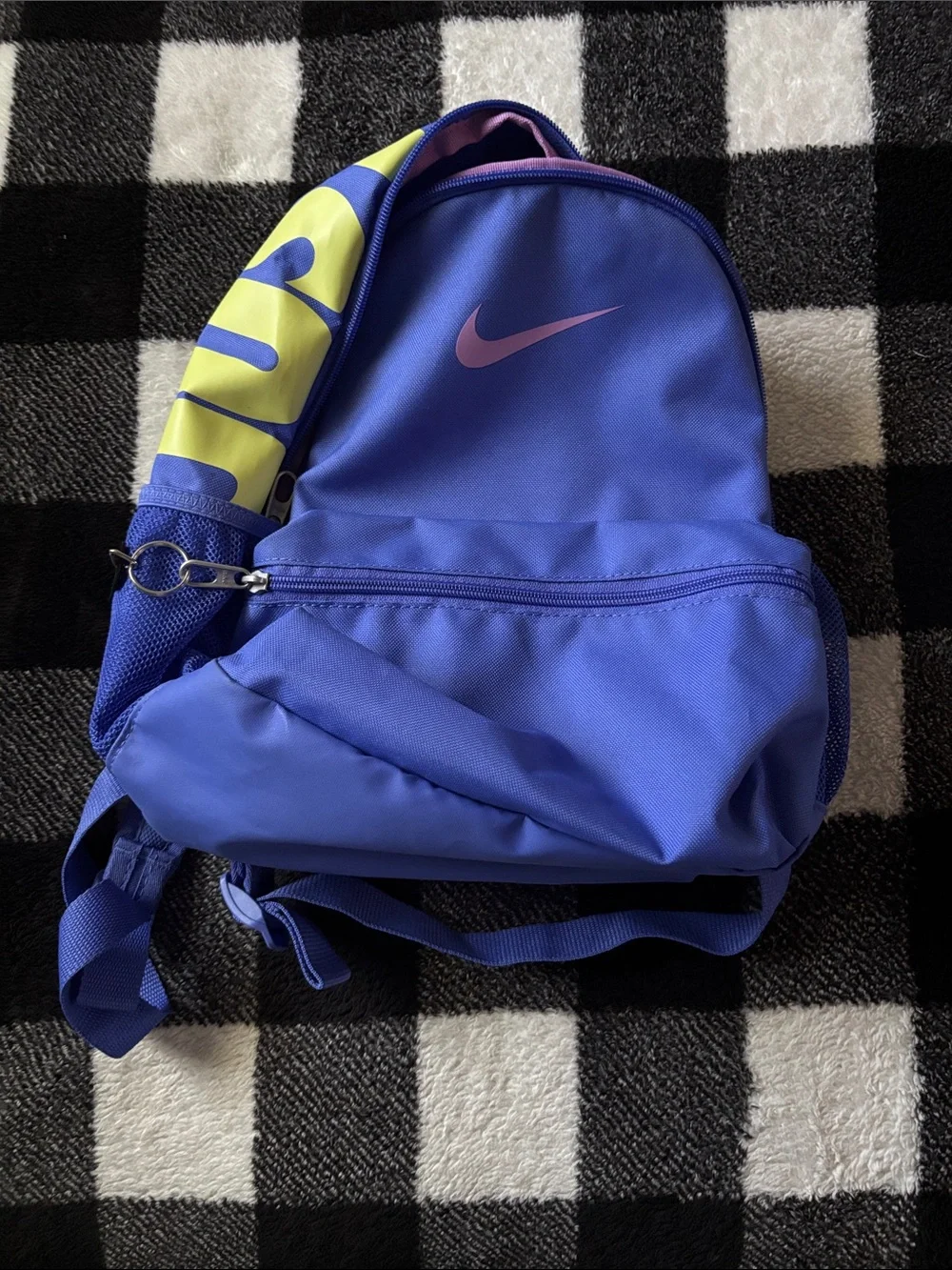 Nike Blue Sling Backpack with Pink Swoosh and Yellow Strap Accent